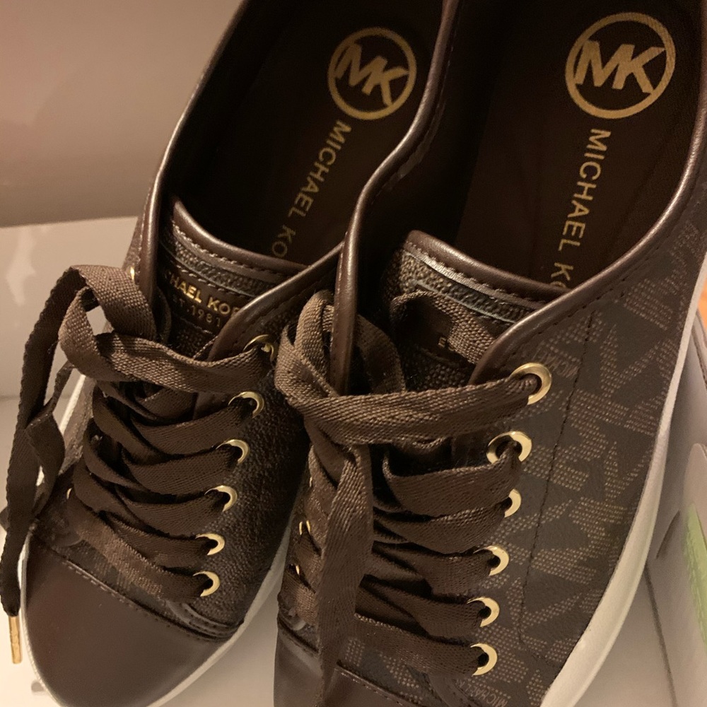 Micheal Kors brown sneakers in a box